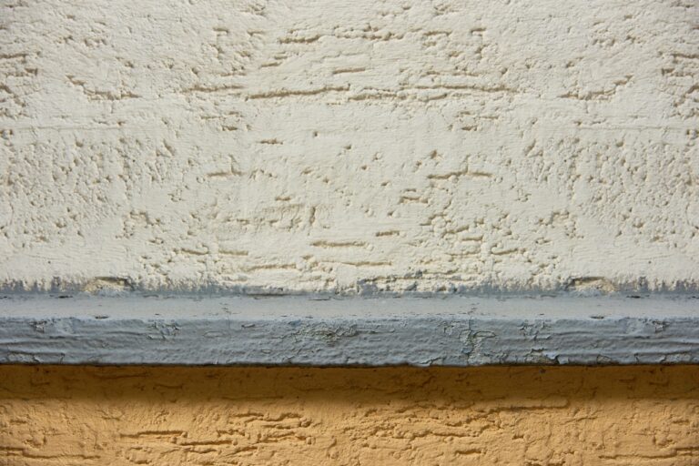 close-up view of white and brown concrete wall textured background