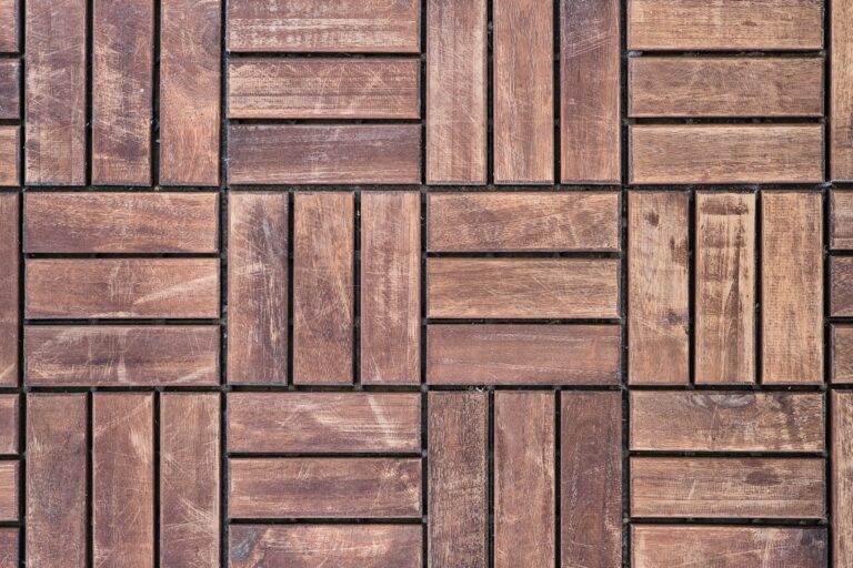 Dark brown wooden floor background from wood bars, recycling and second life of products, top view, idea for a background